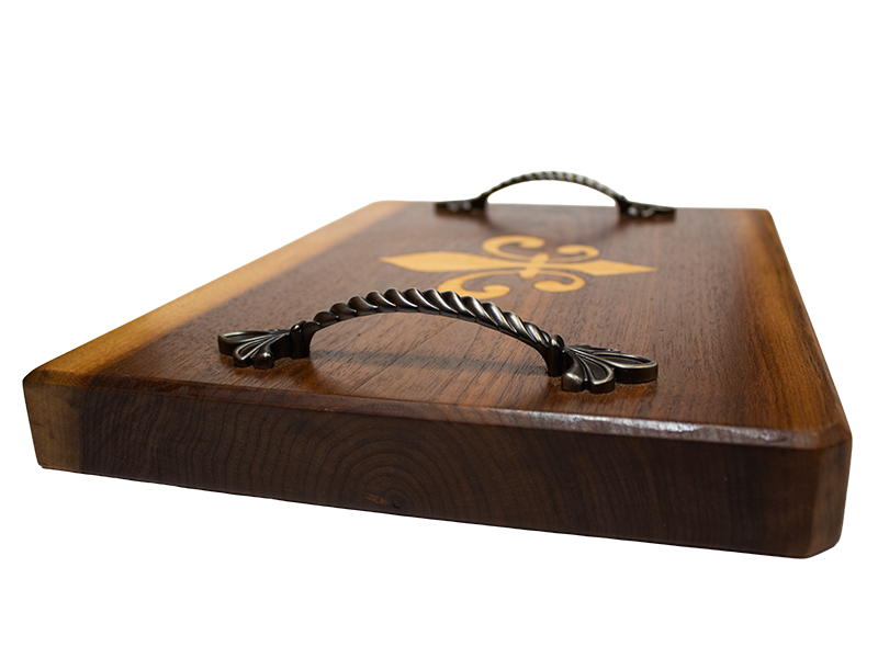 Walnut serving board with Fleur De Lis inlay left side closeup handle view
